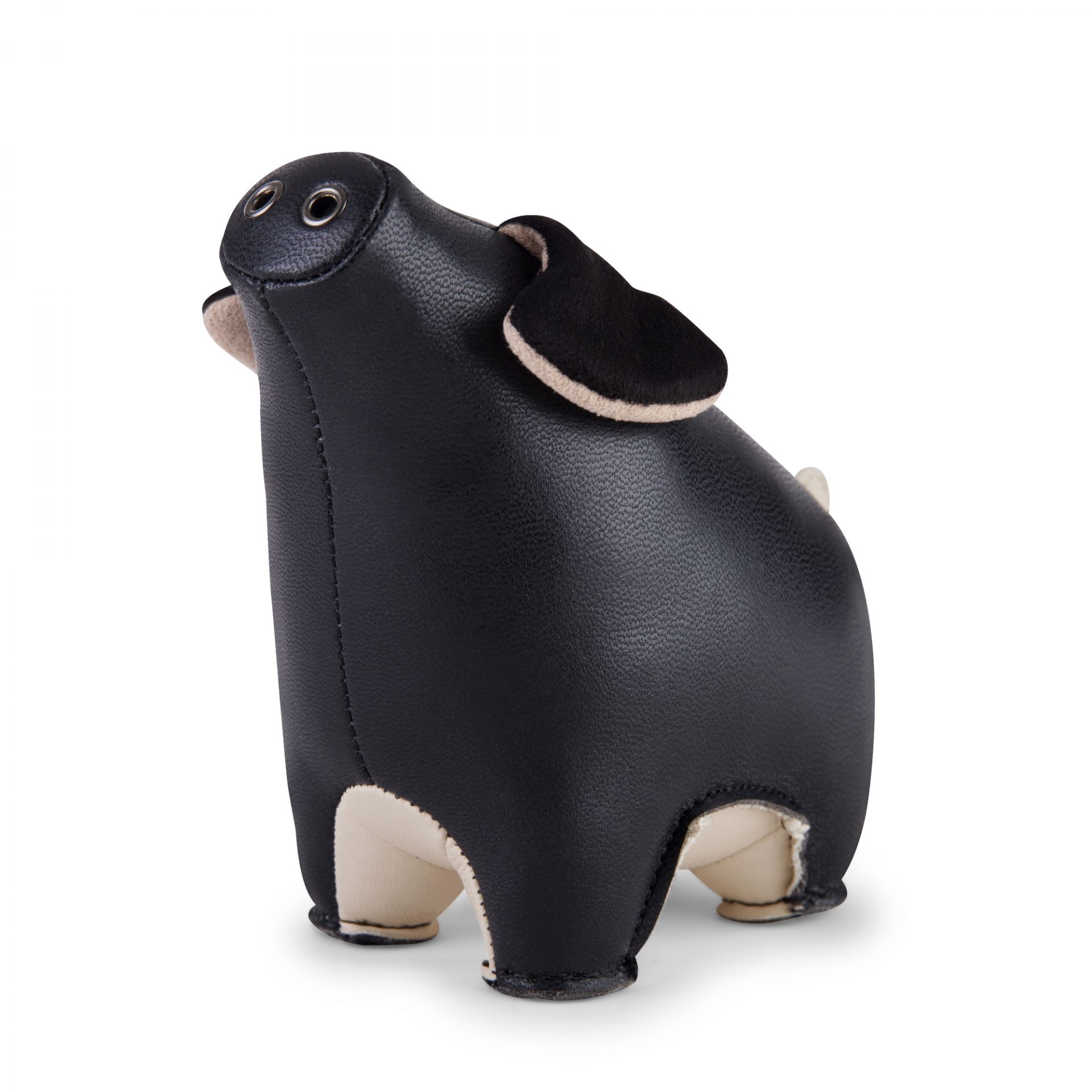 Briefbeschwerer Schwein Diya von Züny, schwarz-weizenfarbenes Kunstleder, dekoratives Accessoire und praktischer Schreibtischhelfer.